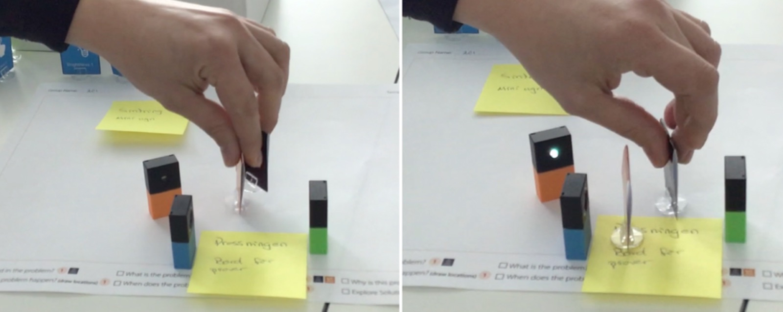 Two photos: a hand moves a paper worker token past a small motion sensor block on the canvas, and in the second photo the sensor shows a light