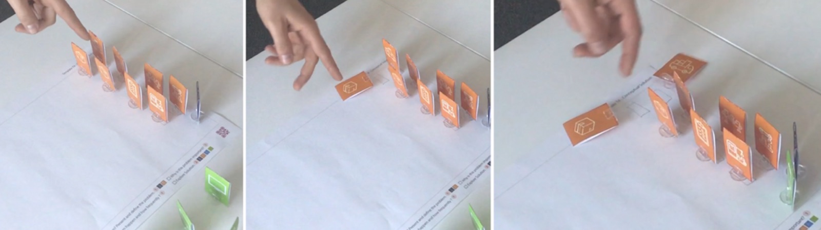 Three photos of a row of orange tokens: a finger pushes one, then another, until two of them lie flat on the canvas