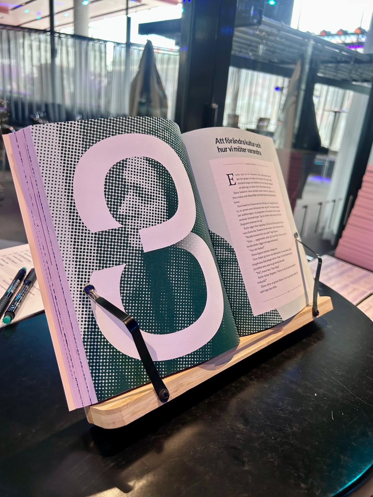 The Swedish edition of the handbook open on a book stand at chapter 3
